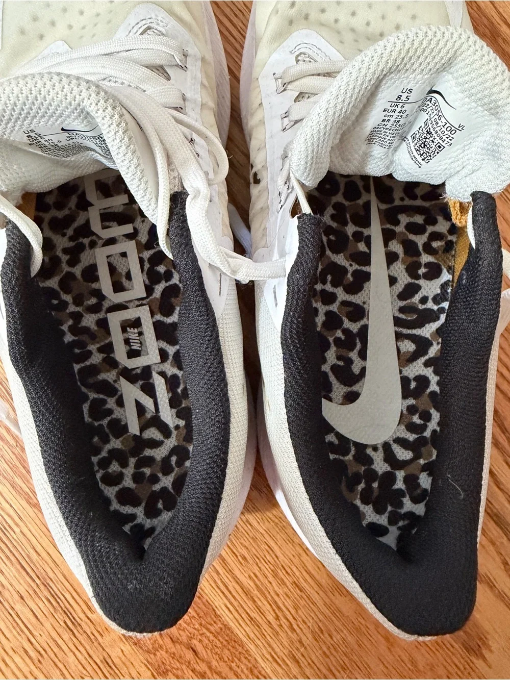 Nike Women’s White Athletic Sneakers with Leopard-Print Swoosh